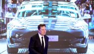 Tesla Inc CEO Elon Musk walks next to a screen showing an image of Tesla Model 3 car during an opening ceremony for Tesla China-made Model Y program in Shanghai, China January 7, 2020. REUTERS/Aly Song//File Photo