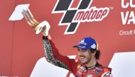 Ducati Lenovo Team's Francesco Bagnaia celebrates on the podium with the trophy after winning the race REUTERS/Pablo Morano