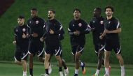 Qatar players in action during a training session yesterday. 