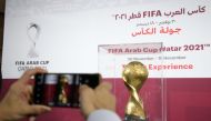 A fan takes a photograph of the FIFA Arab Cup trophy. Pic: Mohamed Farag