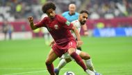 Qatar’s Akram Afif in action with a Bahraini player during their Group A match at Al Bayt Stadium on Tuesday. Picture: Abdul Basit / The Peninsula