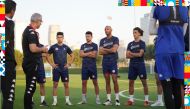 Tunisia's coach Mondher El Kabir speaks to his players during a training session in Doha. Pic: Twitter/@FTF_OFFICIELLE