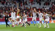 Tunisia players celebrate after the match.