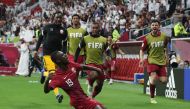 Almoez Ali celebrates after scoring Qatar's first goal against Iraq at Al Bayt Stadium, yesterday.