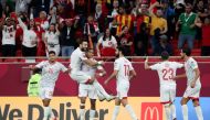 Tunisia’s Jaziri Seifeddine celebrates with team-mates after scoring against the United Arab Emirates at Al Thumama Stadium, on Monday.