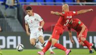 Jordan’s Mohamed Zraiq vies for the ball possession with Palestinian's Mohammed Rashid.