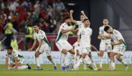 Algerian players celebrate after winning the match.