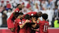 Qatar players celebrate. 