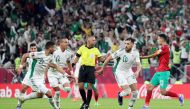  Algeria’s Mohammed Belaili (right) celebrates with team-mates after scoring their second goal.