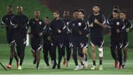 Qatar captain Hassan Al Haydos with team-mates during a training session, yesterday. 