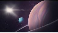 An artist's rendering shows a moon with a diameter roughly 2.6 times that of Earth orbiting a large gas giant planet in another solar system located about 5,700 light years from our solar system, in an undated handout illustration. Helena Valenzuela Widerstrom/Handout via REUTERS