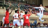 A Qatari player prepares to shoot at the goal during the Asian Men’s Handball Championship Group C match against Oman, yesterday. 