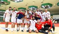 Qatar players celebrate their win over  Uzbekistan on Monday.