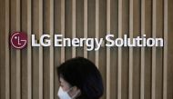 An employee walks past the logo of LG Energy Solution at its office building in Seoul, South Korea, November 23, 2021. Picture taken November 23, 2021. REUTERS/Kim Hong-Ji