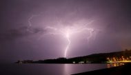 Lightning strikes are seen above Villarrica lake, in Villarrica, Chile, December 7, 2021. REUTERS/Cristobal Saavedra Escobar/File Photo