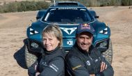 Nasser Saleh Al Attiyah poses with team-mate Jutta Klienschmidt. 