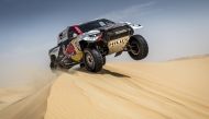 Nasser Saleh Al Attiyah in action during the Abu Dhabi Desert Challenge. RIGHT:  Nasser Saleh Al Attiyah and co-driver Mathieu Baumel at the presentation.