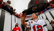 Tampa Bay Buccaneers quarterback Tom Brady (12) hands his hat to a fan after beating the Philadelphia Eagles 31-15 in a NFC Wild Card playoff football game at Raymond James Stadium. Mandatory Credit: Nathan Ray Seebeck-USA TODAY Sports TPX IMAGES OF THE DAY/File Photo