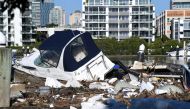 Boats and other debris are seen washed into Hawthorne ferry terminal by the force of floodwaters following heavy rains in Brisbane, Queensland, Australia March 2, 2022. AAP Image/Darren England via REUTERS