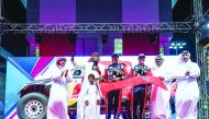 Qatar Motor and Motorcycle Federation (QMMF) President Abdul Rahman bin Abdul Latif Al Mannai with QMMF's Executive Director Amro Al Hamad, champions Nasser Saleh Al Attiyah Al Attiyah and French co-driver Mathieu Baumel along with other officials during the presentation ceremony, yesterday. 