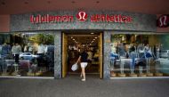 A woman walks into a store of yogawear retailer Lululemon Athletica in downtown Vancouver June 11, 2014. Reuters/Ben Nelms

