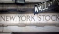 A Wall Street sign is pictured outside the New York Stock Exchange in New York. (REUTERS/Carlo Allegri/File Photo)