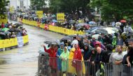 July 1, 2022 Spectators are seen with umbrellas due to rain before the stage 1 REUTERS/Annegret Hilse