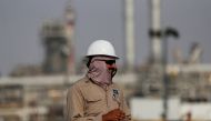 An employee looks on at Saudi Aramco oil facility in Abqaiq, Saudi Arabia October 12, 2019. Reuters/Maxim Shemetov/File Photo