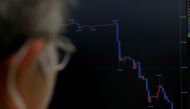 File photo: A staff member of the foreign exchange trading company Gaitame.com watches a monitor displaying a graph of the Japanese yen exchange rate against the US dollar at its dealing room in Tokyo, Japan September 22, 2022. Reuters/Kim Kyung-Hoon/File Photo