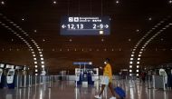 A woman makes her way in the departures area of the Terminal 2E at Charles-de-Gaulle airport in Roissy, near Paris, France, on April 2, 2021.  File Photo / Reuters
