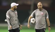 Qatar coach Felix Sanchez with an assistant. 