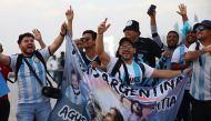 Fans celebrate the arrival of the Argentina team. REUTERS