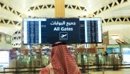 File photo: A man checks the flight timings at the King Khalid International Airport in Riyadh, Saudi Arabia, May 16, 2021. (REUTERS/Ahmed Yosri)