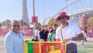 The duo pose for photographs outside Khalifa International Stadium.