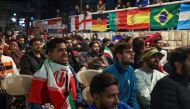 People gather as they watch FIFA World Cup Qatar 2022 match between Iran and United States in Beirut’s southern suburbs.