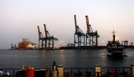 File photo: A man stands opposite the modern port at the harbour in Port Sudan at Red Sea State. (REUTERS/Mohamed Nureldin Abdallah)