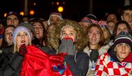 Spectators react as they watch the Qatar 2022 semi-final match between Argentina and Croatia, in the main square of Zagreb on Tuesday. AFP