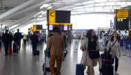 Passengers walk with their luggage through Heathrow Terminal 5 airport in London, Britain, on June 1, 2022. File Photo / Reuters
