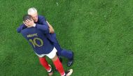 France's coach Didier Deschamps and France's forward #10 Kylian Mbappe after they won the Qatar 2022 World Cup semi-final football match between France and Morocco at the Al-Bayt Stadium on December 14, 2022. (Photo by Giuseppe Cacace / AFP)