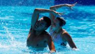 China's She Haoyu and Zhang Yiyao perform during the mixed duet free final Artistic swimming - FINA World Championships at the Alfred Hajos swimming Complex, Budapest, Hungary, June 25, 2022. (REUTERS/Lisa Leutner)