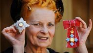 In this file photo taken on June 09, 2006, British Fashion designer Dame Vivienne Westwood poses for photographers after collecting her ensignia from the Prince of Wales during an Investiture ceremony at Buckingham Palace in London. (Photo by Fiona Hanson / POOL / AFP)