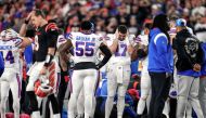 Cincinnati, Ohio, USA; The Buffalo Bills gather as an ambulance parks on the field while CPR is administered to Buffalo Bills safety Damar Hamlin (3) after a play in the first quarter of the NFL Week 17 game between the Cincinnati Bengals and the Buffalo Bills at Paycor Stadium in Downtown Cincinnati. Mandatory Credit: Sam Greene-USA TODAY Sports