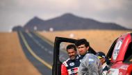 Nasser Al Attiyah of Qatar (left) reacts after the Stage 3 of the Dakar Rally. AFP
