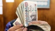 File Photo: An employee counts Egyptian pounds at a foreign exchange office in central Cairo, Egypt, March 20, 2019. (REUTERS/Mohamed Abd El Ghany)