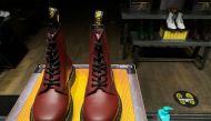 A pair of Dr. Martens boots seen through the window of a Dr Martens shop in London, Britain, September 17, 2020. REUTERS/Simon Newman/File Photo