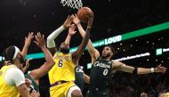 Jayson Tatum #0 of the Boston Celtics defends LeBron James #6 of the Los Angeles Lakers in the final shot of regulation play during the fourth quarter at TD Garden in Boston, Massachusetts, on January 28, 2023. (Photo by Maddie Meyer / Getty Images via AFP)