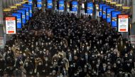 Crowds wearing protective masks, following an outbreak of the coronavirus, are seen at the Shinagawa station in Tokyo, Japan, March 2, 2020. (REUTERS/Athit Perawongmetha)