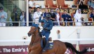 Ghanim Nasser Al Qadi celebrates after completing his round astride Morocco.