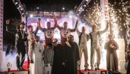 QMMF President Abdulrahman Al Mannai and QMMF Executive Director Amro Al Hamad pose with podium winners. 