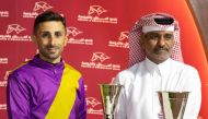 Al Uqda Complex Manager Abdulaziz Jassim Al Boenain presents the trophy to Alberto Sanna. Pictures: Juhaim/QREC